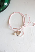 A cow with a piercing on a strap