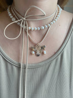 A cow with a piercing on a strap